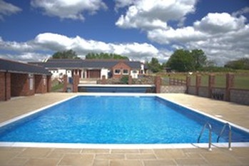 The outdoor heated pool at West Fleet Holiday Farm